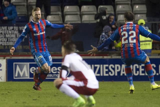 Billy Mckay, left, celebrates his winner with Brad McKay, while Barrie McKay watches on. Picture: SNS