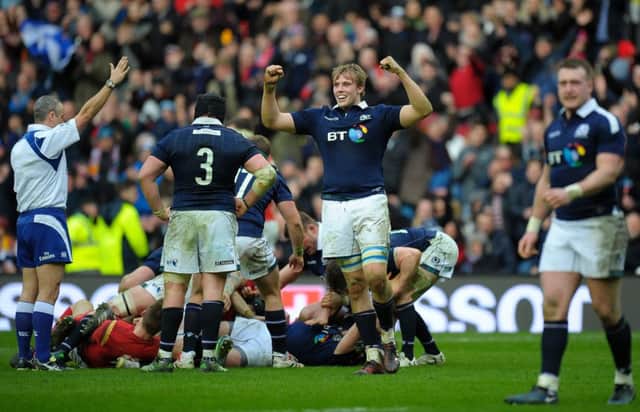Scotland celebrate a momentous win. Picture: ANDY BUCHANAN/AFP/Getty Images