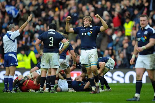 Scotland celebrate a momentous win. Picture: ANDY BUCHANAN/AFP/Getty Images