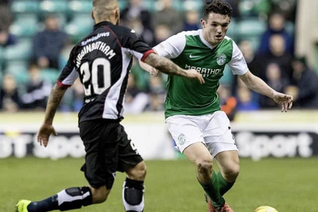 ohn McGinn takes on Kallum Higginbotham during the Easter Road clash between Hibernian and Dunfermline Athletic. Picture: SNS/Alan Rennie