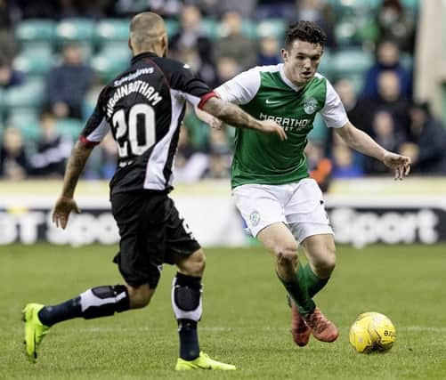 ohn McGinn takes on Kallum Higginbotham during the Easter Road clash between Hibernian and Dunfermline Athletic. Picture: SNS/Alan Rennie
