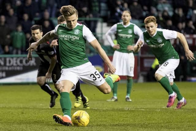 Hibs Jason Cummings scores from the penalty spot to put his team two goals in front. Picture: SNS.