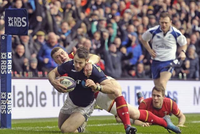 Tommy Seymour crashes over for Scotlands first try. Picture: Neil Hanna.