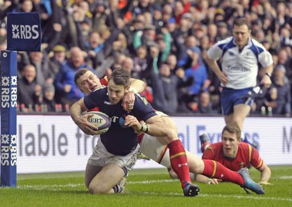 Tommy Seymour crashes over for Scotlands first try. Picture: Neil Hanna.