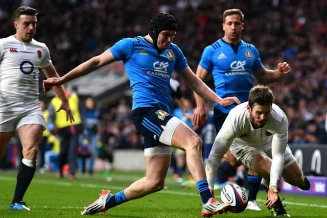 Italian Carlo Canna denies Englands Elliot Daly a second-half try. Picture: Getty.