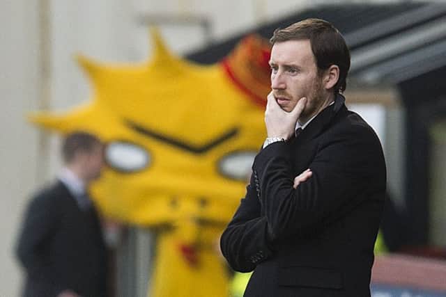 A dejected Ian Cathro watches his side lose to Partick Thistle. Picture: SNS
