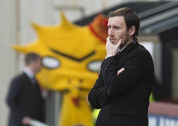 A dejected Ian Cathro watches his side lose to Partick Thistle. Picture: SNS