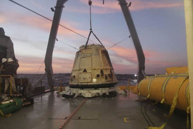 SpaceX Dragon capsule sits aboard a ship in the Pacific Ocean west of Mexico's Baja Peninsula after returning from the International Space Station.(AP Photo/SpaceX, File)