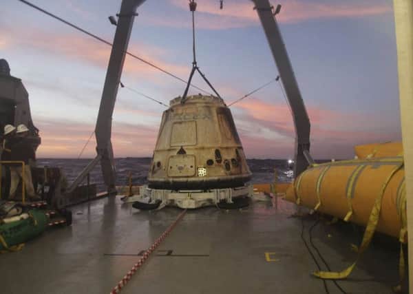 SpaceX Dragon capsule sits aboard a ship in the Pacific Ocean west of Mexico's Baja Peninsula after returning from the International Space Station.(AP Photo/SpaceX, File)