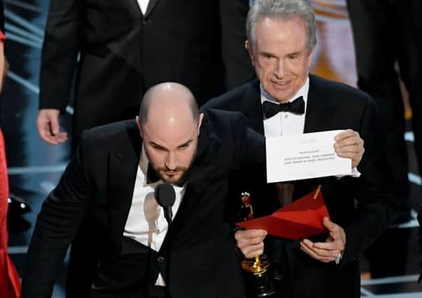 The moment that Hollywood realised a huge mistake had been at the Oscars. Picture: Getty