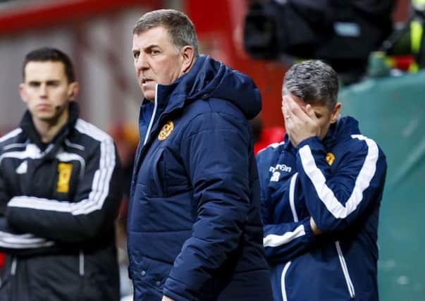 A grim-looking Mark McGhee in the Fir Park dugout as Motherwell lost 5-1 to Dundee. Picture: Roddy Scott/SNS