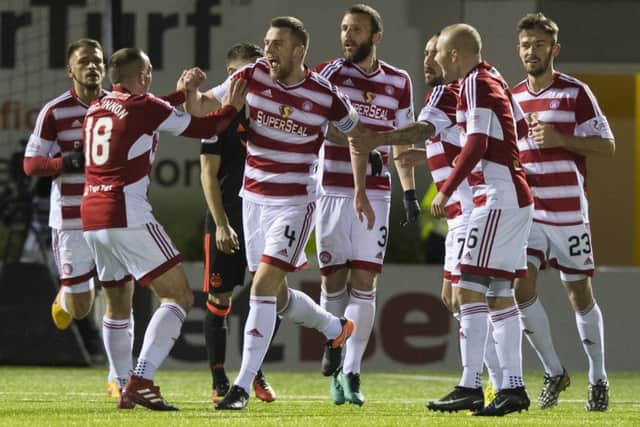 Hamilton's Mikey Devlin (No 4) celebrates with his team-mates after scoring what proved to be the winning goal against Aberdeen. Picture: SNS Group