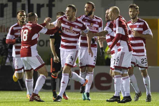 Hamilton's Mikey Devlin (No 4) celebrates with his team-mates after scoring what proved to be the winning goal against Aberdeen. Picture: SNS Group