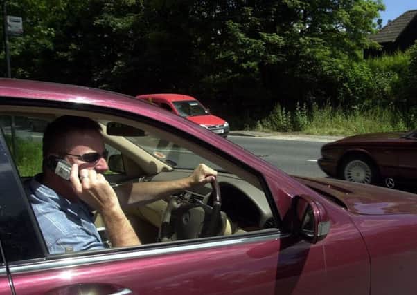 Penalties are becoming tougher for those who use mobile phones while driving. Picture: Barry Phillips/Evening Stand/REX/Shutterstock