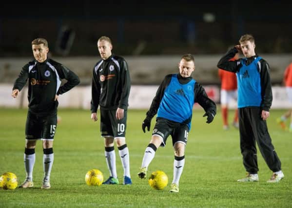 Former Hibs and Celtic striker Derek Riordan warms up before kick-off against Cowdenbeath at new club Edinburgh City on Tuesday, but didn't get on. Picture: Ian Georgeson
