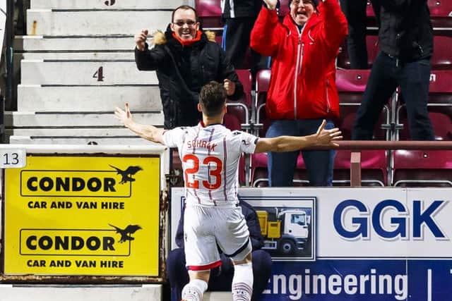 Ross County's Alex Schalk celebrates opening the scoring for the away side. Picture: SNS