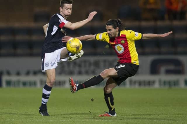 Dundee's Cammy Kerr (L) and Ryan Edwards battle for possession. Picture: SNS