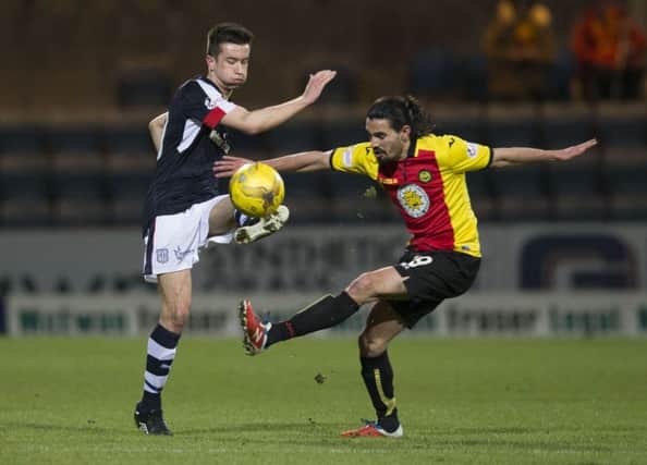 Dundee's Cammy Kerr (L) and Ryan Edwards battle for possession. Picture: SNS