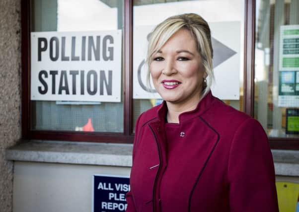 Michelle O'Neill, Sinn Fein leader in Northern Ireland, outside of St Patrick's Primary School before casting her vote. Picture: Liam McBurney/PA Wire