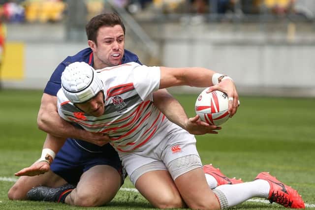Scotland's James Fleming makes a try-saving tackle against Phil Burgess of England in the quarter-finals of the Wellington Sevens. Picture: Getty Images