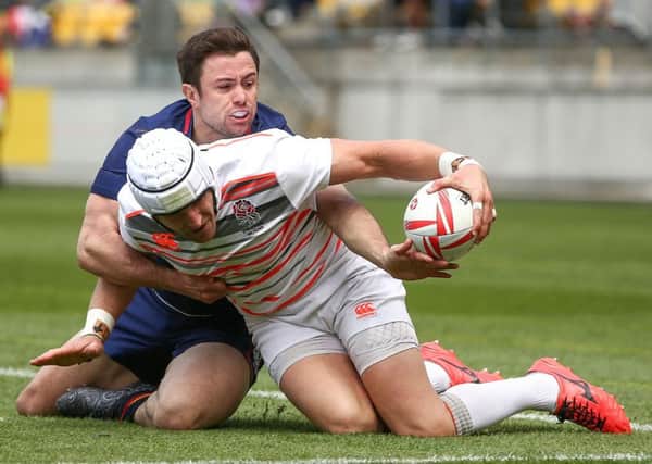 Scotland's James Fleming makes a try-saving tackle against Phil Burgess of England in the quarter-finals of the Wellington Sevens. Picture: Getty Images
