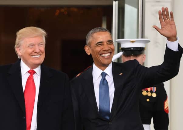 Presidents Donald Trump and Barrack Obama in happier times. Picture: AFP/Getty Images