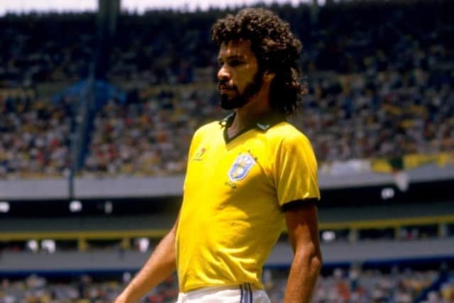 Brazil's Socrates takes a rest during the 1986 World Cup match against Spain at the Jalisco Stadium in Guadalajara, Mexico. Picture: Mike King/Allsport