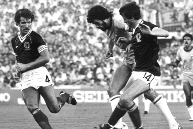 Brazil beat Scotland 4-1 at the Benito Villamarin stadium in Seville during the 1982 World Cup, (from left) Graeme Souness, Socrates and David Narey in action. Picture: Keystone/Getty Images