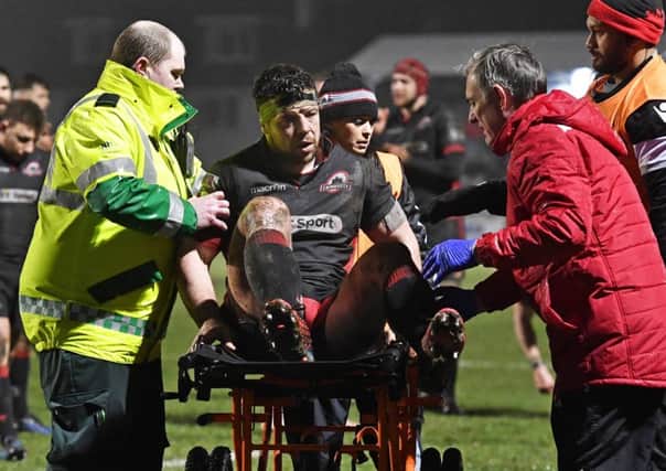 Edinburgh's Alasdair Dickinson is carted off after being injured against Ospreys. Picture: Rob Casey/SNS