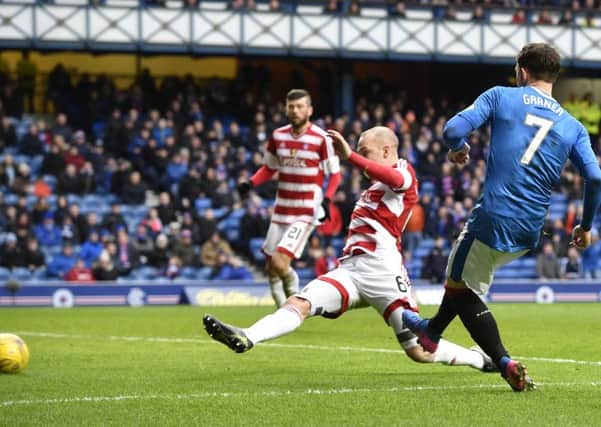 Joe Garner scores the second goal of his hat-trick. Picture: SNS.