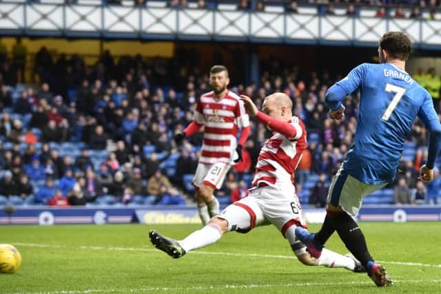 Joe Garner scores the second goal of his hat-trick. Picture: SNS.