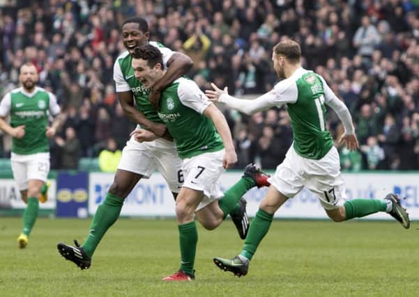 Marvin Bartley celebrates with John McGinn after the midfielder put Hibs into the lead. Picture: SNS.