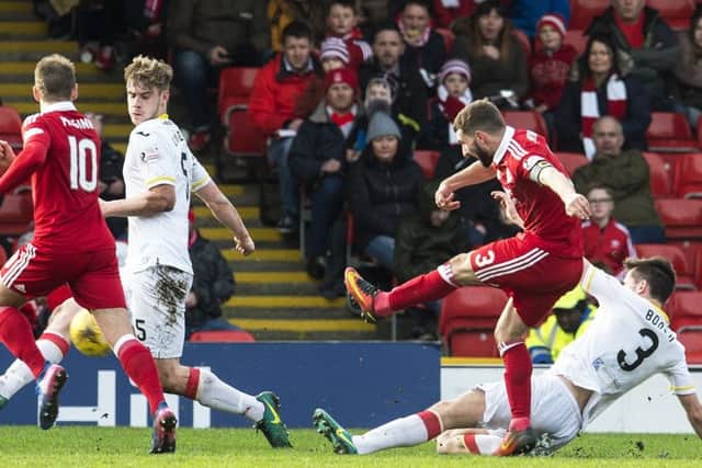 Graeme Shinnie scores the goal which booked Aberdeen's semi-final place. Picture: SNS.