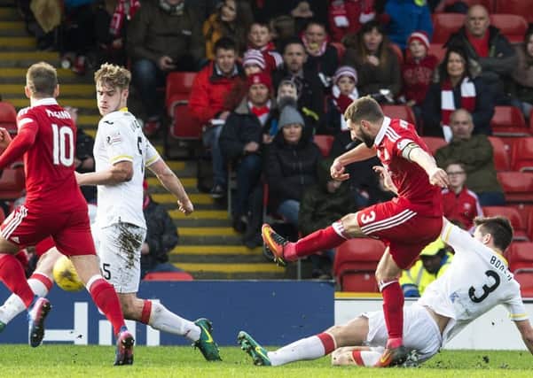 Graeme Shinnie scores the goal which booked Aberdeen's semi-final place. Picture: SNS.