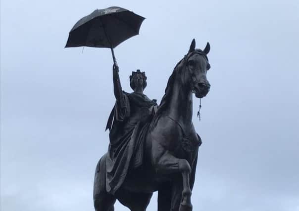 The Queen Victoria statue - with a modern accessory. Picture: Chris Cunningham/Twitter