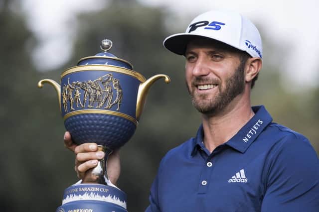Dustin Johnson poses with his Mexico Championship trophy at the Chapultepec Golf Club in Mexico City. Picture: AP