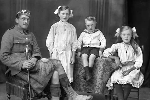 A WWI soldier from Caithness and his three children. PIC Johnston Collection Wick.