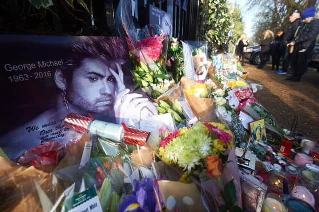 Flowers, candles and messages were left by well-wishers and fans outside George Michaels London home in the wake of his death. Picture: AFP/Getty Images