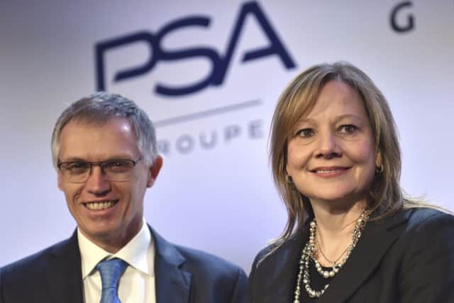 PSA chief Carlos Tavares with GM boss Mary Barra. Picture: Zacharie Scheurer/AP