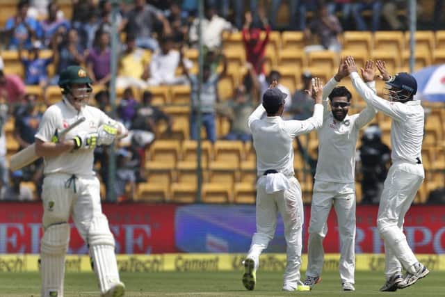 India's Ravindra Jadeja, second right, celebrates with team-mates after the dismissal of Australia's captain Steve Smith Picture: Aijaz Rahi/AP