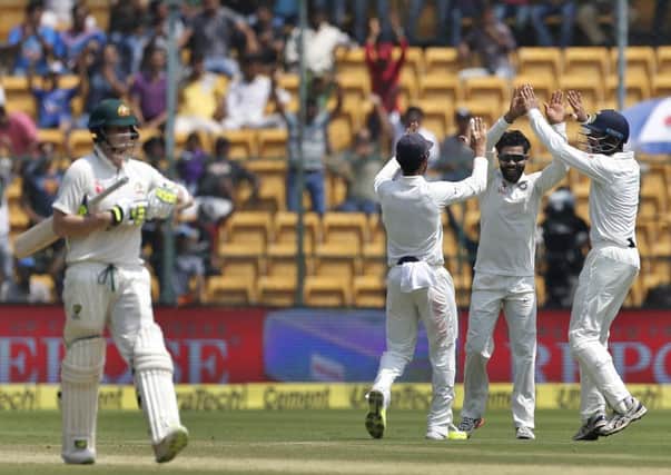 India's Ravindra Jadeja, second right, celebrates with team-mates after the dismissal of Australia's captain Steve Smith Picture: Aijaz Rahi/AP
