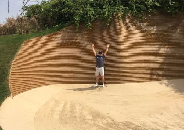 Scotlands Richie Ramsay in one of the huge bunkers at Dlf Golf and Country Club in New Delhi, which is hosting the Hero Indian Open.