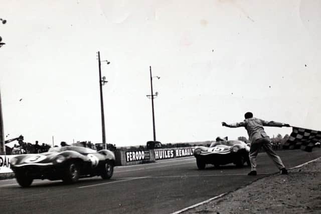 Ecurie Ecosse cars cross the finishing line 1st and 2nd at Le Mans.