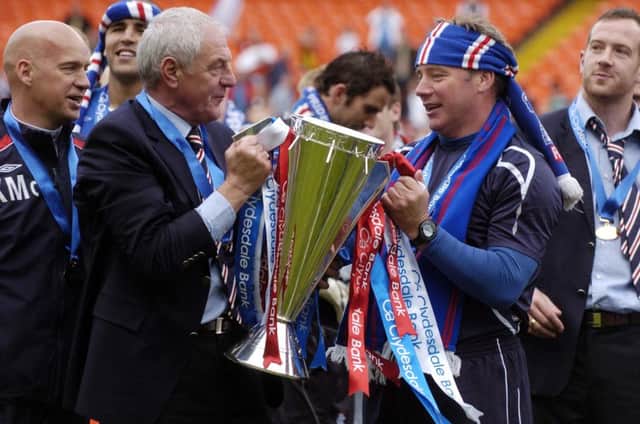 Ally McCoist, right, alongside former boss Walter Smith after Rangers clinched the SPL crown in 2009. Picture: Phil Wilkinson