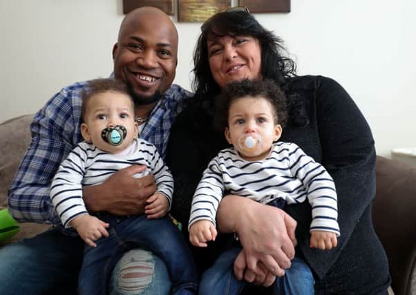 Tracy and Pete Akoun, with their daughters Nyobi, right, and Kenya, who were born a month apart. Picture: PA