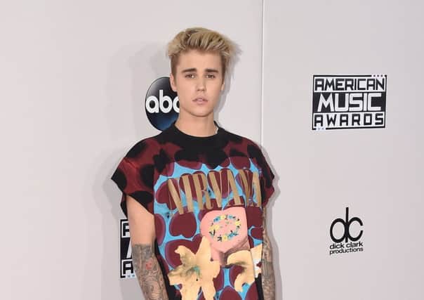 Australian lecturer Gordon Chalmers posed as Justin Bieber (above) online  (Photo by Jason Merritt/Getty Images)