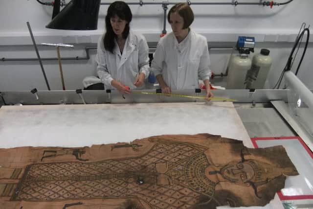 The shroud is examined. Picture: National Museum of Scotland