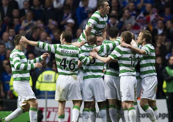 Rangers had won the title, but Celtic celebrate victory in the Old Firm match as if they were the champions. Picture: SNS.