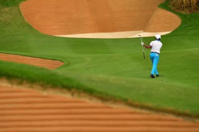 S.S.P Chawrasia of India plays a shot between bunkers during the first round of the Hero Indian Open in New Delhi. Picture: Stuart Franklin/Getty Images