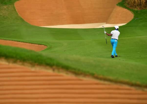 S.S.P Chawrasia of India plays a shot between bunkers during the first round of the Hero Indian Open in New Delhi. Picture: Stuart Franklin/Getty Images